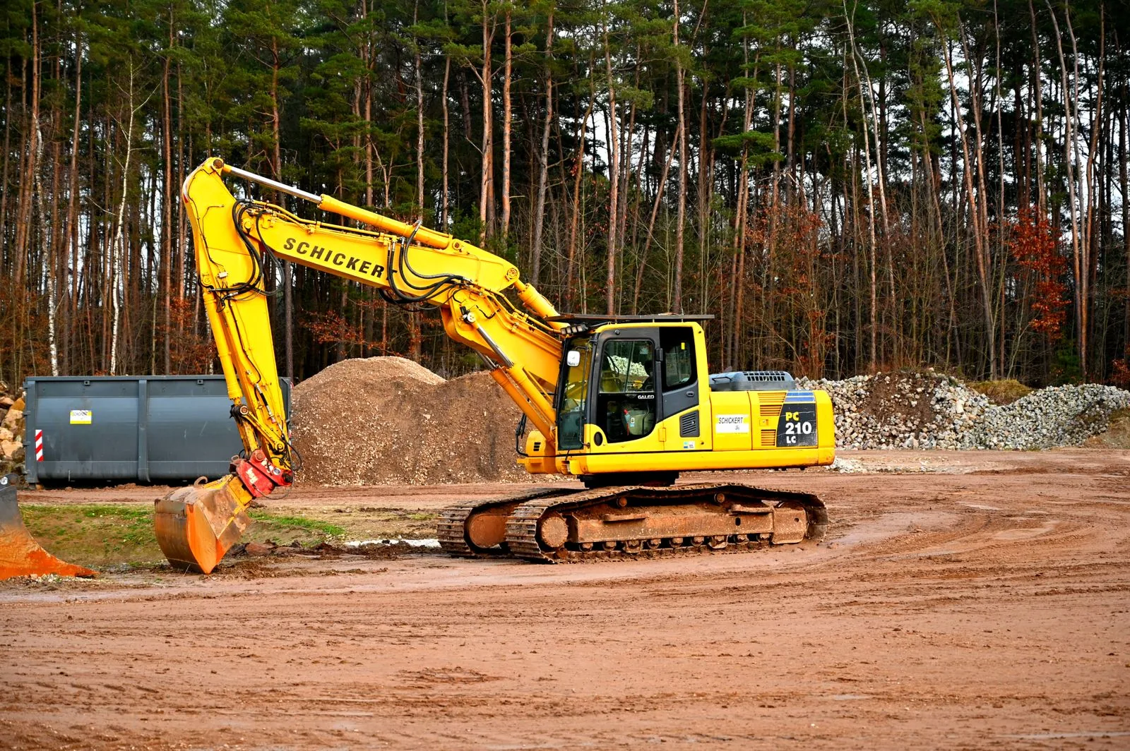 Stock photograph of tracked excavation equipment on a prepared dirt worksite