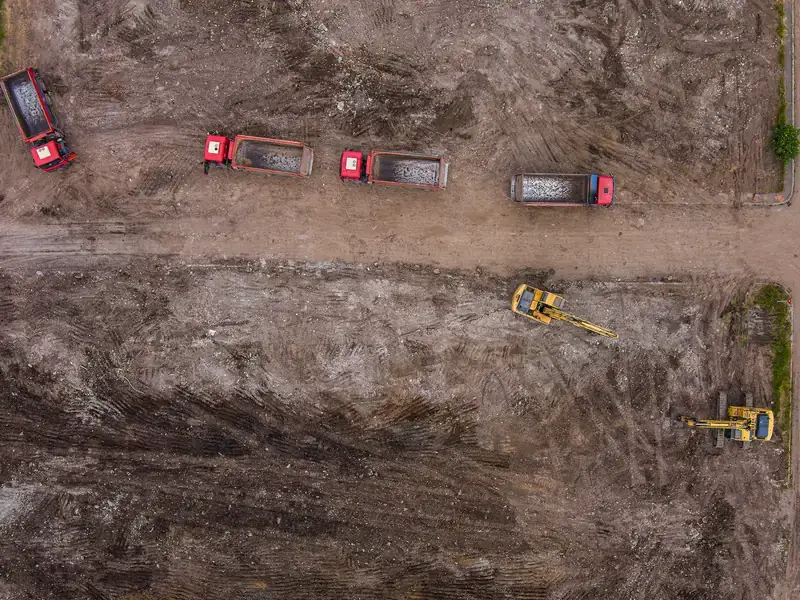 Aerial view of site preparation with dump trucks in Magnolia, Illinois